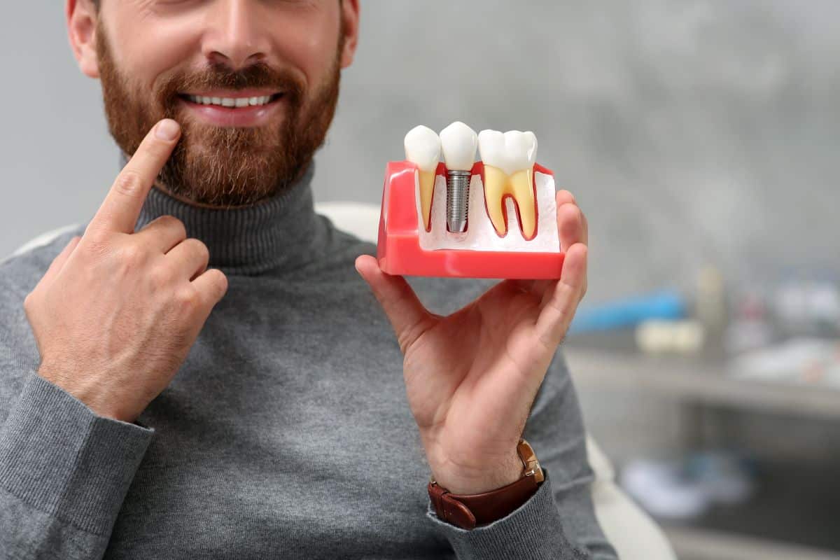 Patient showing his dental implants in Rocklin, Roseville, or Granite Bay.