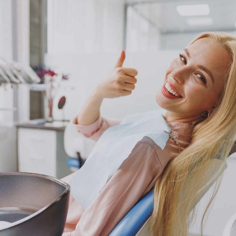 Smiling woman after dental treatment in Rocklin, Roseville, or Granite Bay.