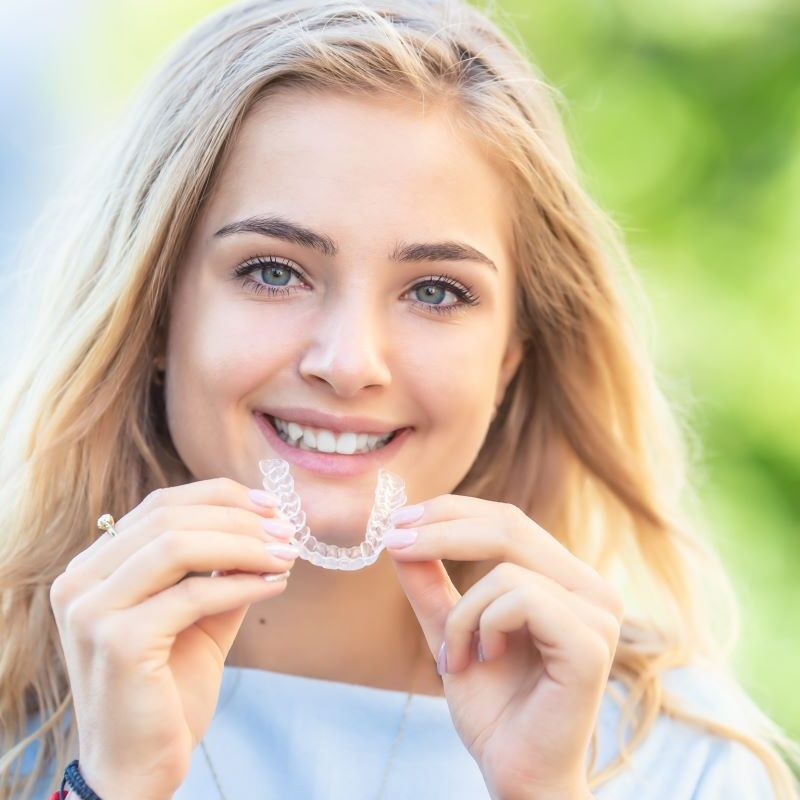 Woman smiling with Invisalign in Rocklin, Roseville, or Granite Bay